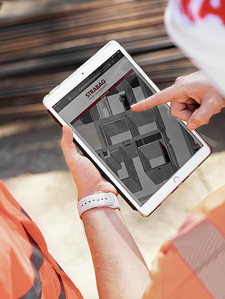 Photo of BIM specialists viewing a project on an iPad